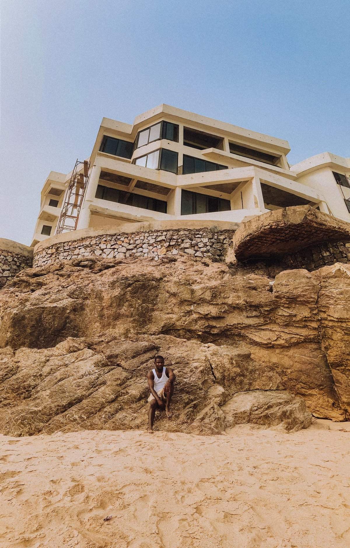 Coastal building and rocky shoreline in Ghana