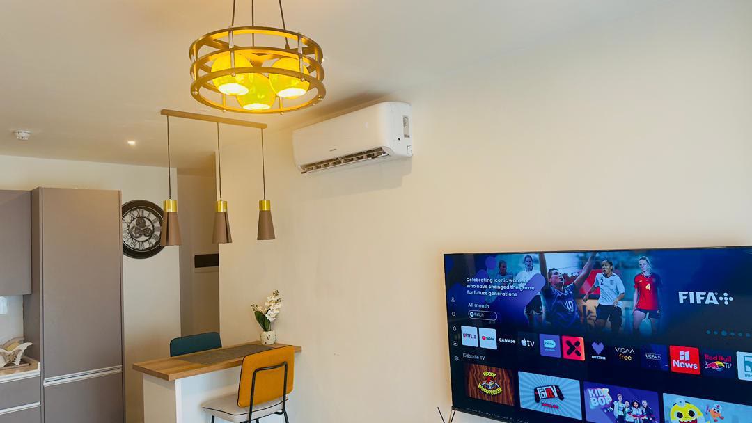 Open-plan kitchen and dining with pendant lighting