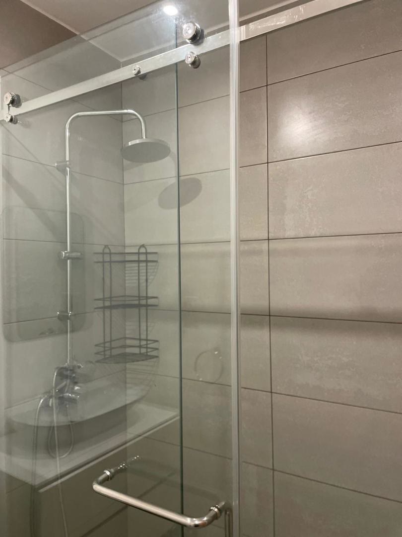 Bathroom with walk-in rain shower